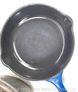 Cooking items: Vintage Le Winter Appliance Co Brushed Aluminum Hammered Dutch Oven 1930's; Le Creuset frying pan; and DRU Holland Blue Tulip Enameled Cast Iron Oval Baker Casserole Dish; blue ceramic creamer