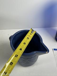 Cooking items: Vintage Le Winter Appliance Co Brushed Aluminum Hammered Dutch Oven 1930's; Le Creuset frying pan; and DRU Holland Blue Tulip Enameled Cast Iron Oval Baker Casserole Dish; blue ceramic creamer