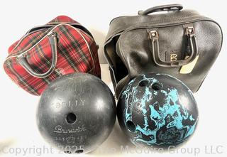 Two (2) vintage Brunswick Bowling balls with carrying bags