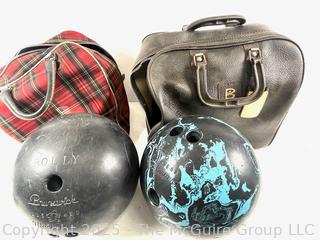 Two (2) vintage Brunswick Bowling balls with carrying bags