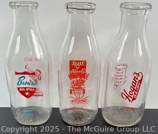 Group of three (3) antique glass milk bottles: various brands