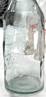 Group of three (3) antique glass milk bottles: various brands