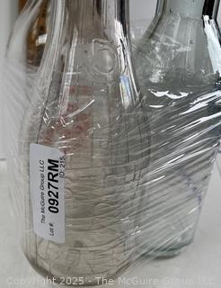 Group of three (3) antique glass milk bottles: various brands