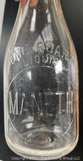 Group of three (3) antique glass milk bottles: various brands