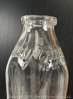 Group of three (3) antique glass milk bottles: various brands