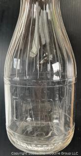 Group of three (3) antique glass milk bottles: various brands