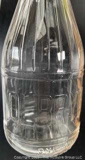 Group of three (3) antique glass milk bottles: various brands