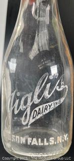 Group of three (3) antique glass milk bottles: various brands