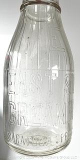 Group of three (3) antique glass milk bottles: various brands