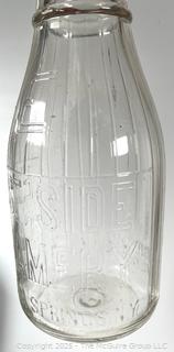 Group of three (3) antique glass milk bottles: various brands