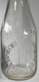 Group of three (3) antique glass milk bottles: various brands