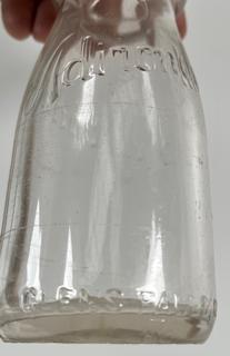 Group of five (5) antique glass pint milk bottles: various brands