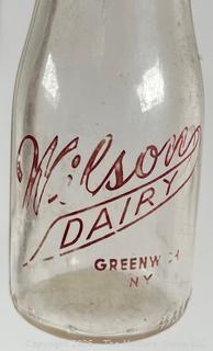 Group of five (5) antique glass pint milk bottles: various brands