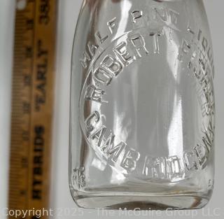 Group of five (5) antique glass pint milk bottles: various brands