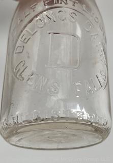 Group of five (53) antique glass milk pint bottles: various brands