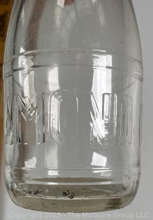 Group of five (53) antique glass milk pint bottles: various brands