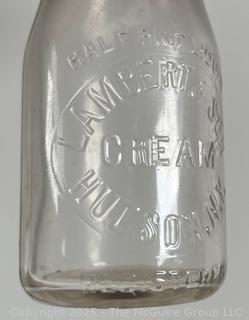 Group of five (53) antique glass milk pint bottles: various brands