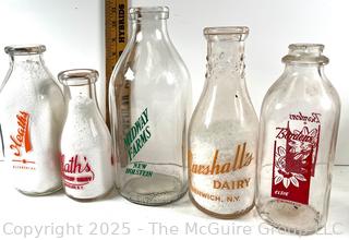 Group of five (53) antique glass milk pint bottles: various brands