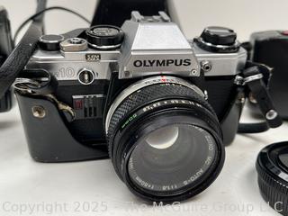 Olympus OM-10 35mm film camera and Vivitar Flash; and Concord AFF 35MMCamera AUTO FOCUS FLASH CAMERA