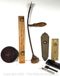 Hardware/Tools: Metal tape ruler; wood ruler; odd hand tool; brass door lock plates