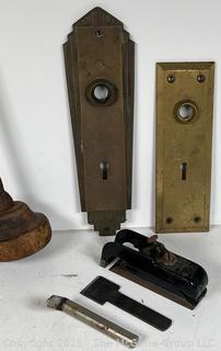 Hardware/Tools: Metal tape ruler; wood ruler; odd hand tool; brass door lock plates
