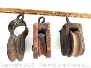 Three (3) Wooden Pulleys