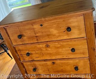 Knotty pine three drawer keyed dresser