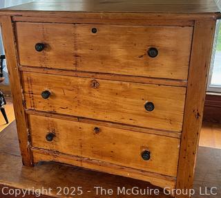Knotty pine three drawer keyed dresser