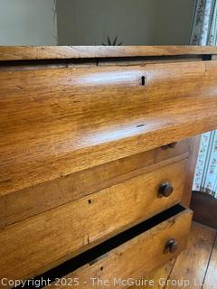 Four-drawer oak(?) keyed dresser, curved top drawer panel