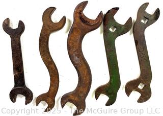Five (5) antique iron wrenches: 4 curved, 1 straight