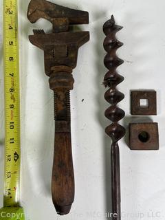 Assortment of antique hand tools: wrenches, drill bit, etc.