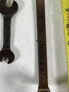Assortment of antique hand tools: wrenches, drill bit, etc.