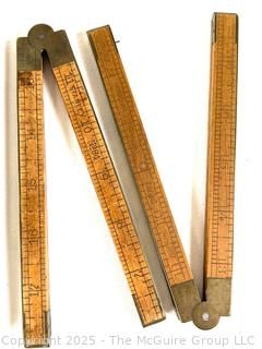 Seven (7) Folding Carpenters' Rulers