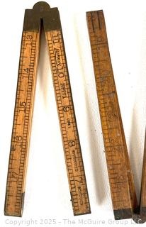 Seven (7) Folding Carpenters' Rulers