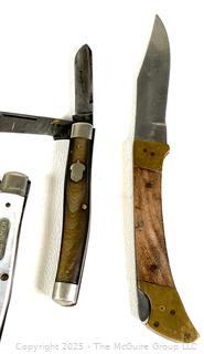 Nine (9) Pocket Knives