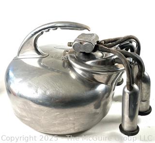 SURGE Milking Bucket Assembly Featuring a "Tug and Pull" Action on the Udder to Encourage Milk Let-Down