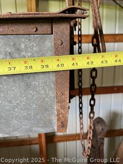 Hay or Manure Carrier System Used in Barns.  System Comprised of a Large Metal Tub Suspended From a Track or Rail. 