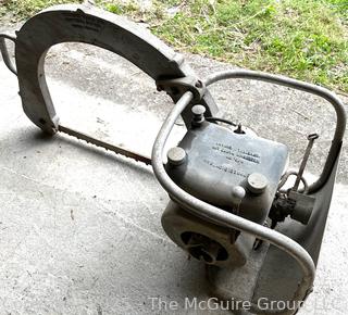 DOLMAR CB 50 Antique Chain Saw w/ Distinctive Bow Bar Designed for Easier Bucking of Wood on the Ground w/Out Excessive Bending. Dolmar is a German Company That Developed the First Gas Powered Chain Saw in 1927