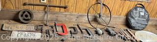 Eclectic Lot Including Jumper Cables, C Clamps, Tire Iron, License Plates and Hubcap
