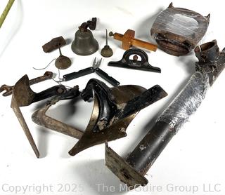 Grouping of Farm and Bench Tools Including Planet Jr. Plow Points and Branded Wrench, Marking Gage, Cow Bell, Hand Crank Jack, Oil Cans, Multi-Tool, Horseshoes and Wood Plane