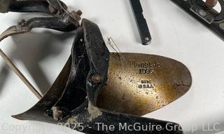 Grouping of Farm and Bench Tools Including Planet Jr. Plow Points and Branded Wrench, Marking Gage, Cow Bell, Hand Crank Jack, Oil Cans, Multi-Tool, Horseshoes and Wood Plane