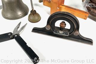 Grouping of Farm and Bench Tools Including Planet Jr. Plow Points and Branded Wrench, Marking Gage, Cow Bell, Hand Crank Jack, Oil Cans, Multi-Tool, Horseshoes and Wood Plane