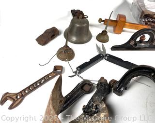 Grouping of Farm and Bench Tools Including Planet Jr. Plow Points and Branded Wrench, Marking Gage, Cow Bell, Hand Crank Jack, Oil Cans, Multi-Tool, Horseshoes and Wood Plane