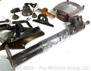Grouping of Farm and Bench Tools Including Planet Jr. Plow Points and Branded Wrench, Marking Gage, Cow Bell, Hand Crank Jack, Oil Cans, Multi-Tool, Horseshoes and Wood Plane