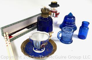 Cobalt Blue Glassware Including Bell Telephone Paperweight, Snowman, Porcelain Cup & Saucer and Chopsticks