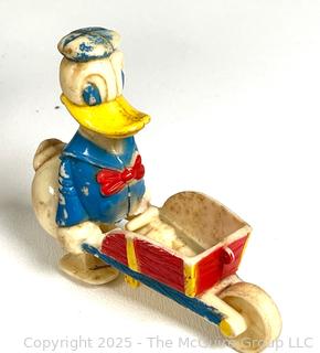 Queen Elizabeth II Coronation Souvenir Tin, Marx Walt Disney Donald Duck Ramp Walker Toy, Wood Egg Cup, Pewter Moose Medal, 1931 International Harvester Company Medal and 1972 American Revolution Bicentennial Commemorative Medal