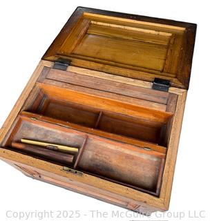 Late 19th C Large Chestnut Carpenters Footed Chest.  Metal Forged Banding at top and Bottom, Metal Handles on Sides.  Multiple Shelves and Cubbies Inside.  Measures 25 x 36 x 28"Tall 