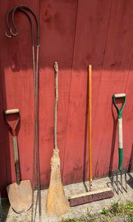 Collection of Lawn and Garden Tools Including Shovels, Push Broom, Shepherds Crooks, Hoe, Rakes, Pitch Forks and Pic Axe