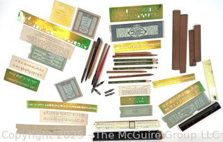 Lettering and drafting stencils and slide ruler