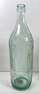 Group of antique glass bottles: various brands